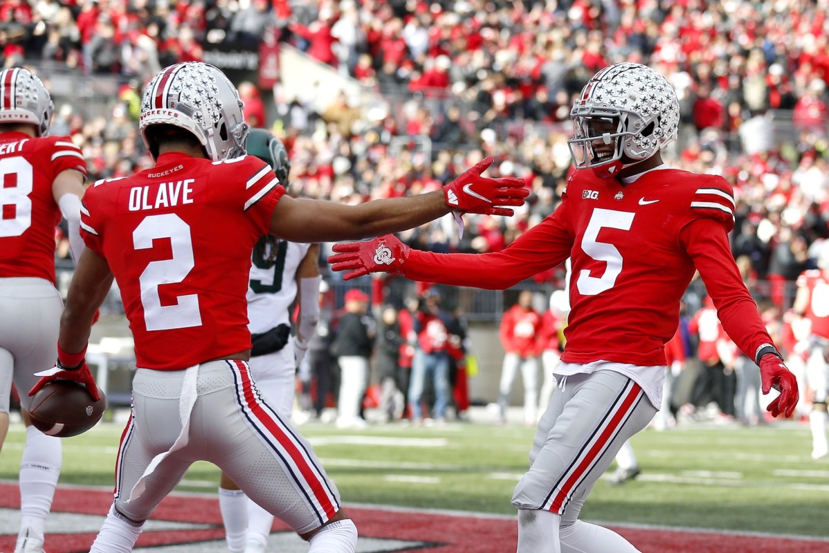 Ohio State wide receivers Chris Olave and Garrett Wilson celebrate touchdown